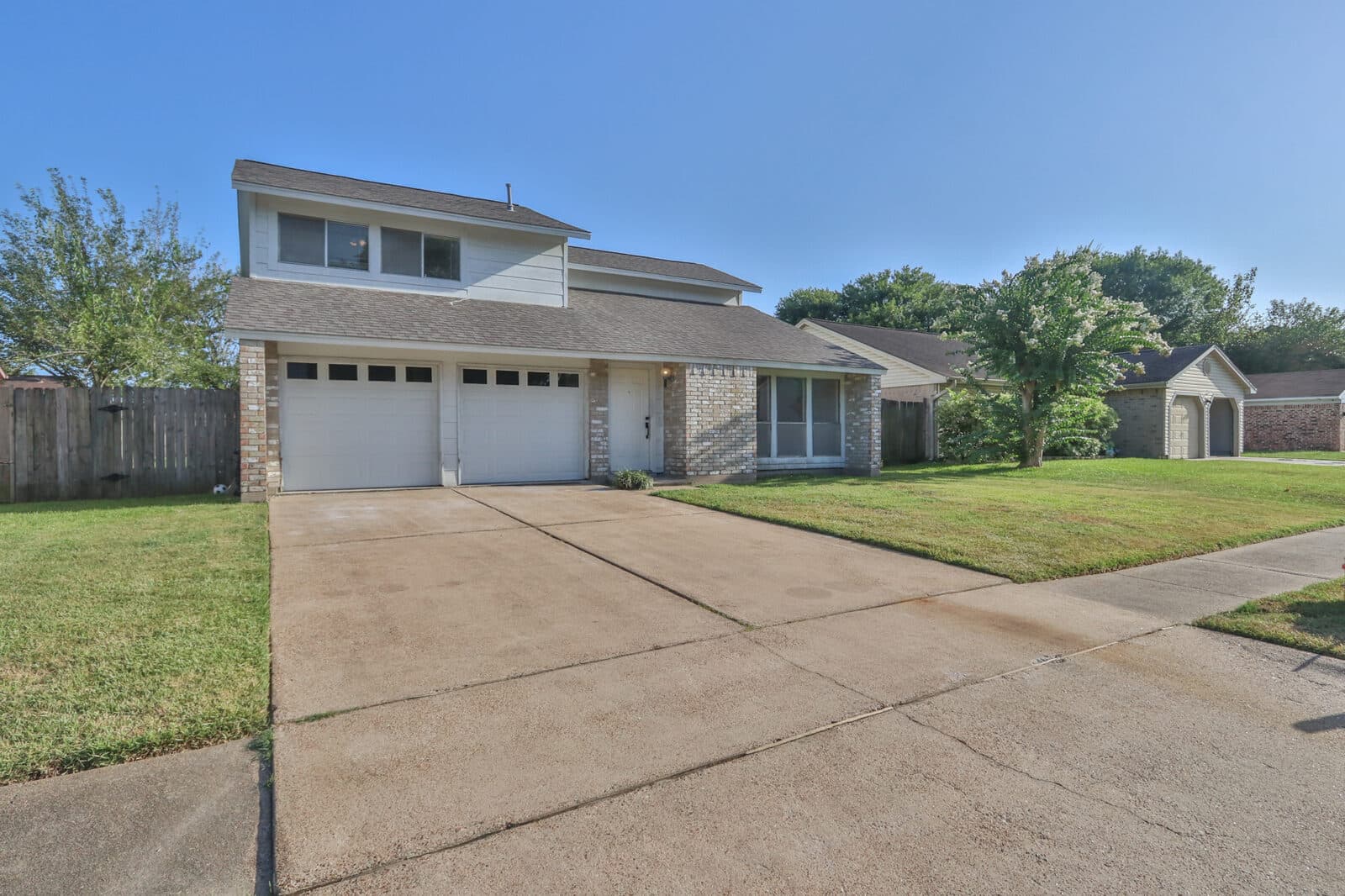 Residential concrete driveway and front exterior in Houston area